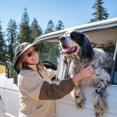 Woman with a dog in a car